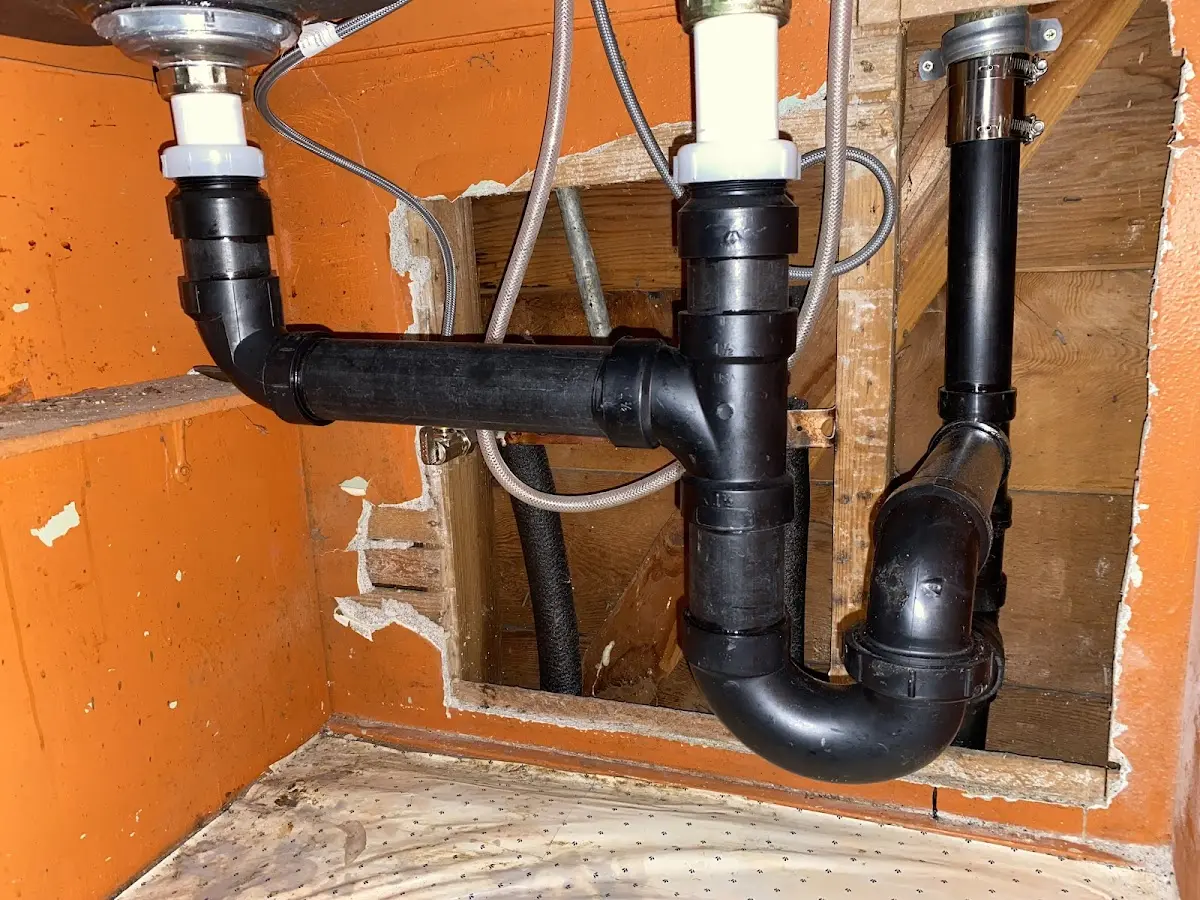 Professional Garbage Disposal Repair equipment and tools on the job in Theodore